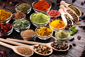 Variety of spices and herbs on kitchen table