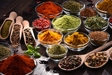 Variety of spices and herbs on kitchen table