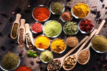 Variety of spices and herbs on kitchen table