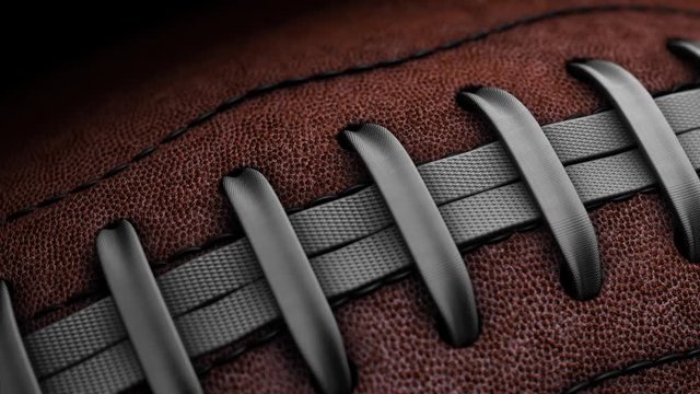 Closeup Pan of Professional American Football