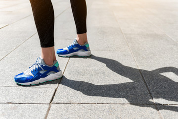 Feet of young woman going for sports