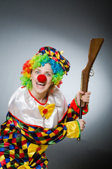 Funny clown in comical concept