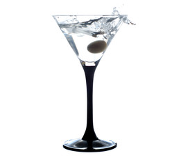 Cocktail martini with olive, a splash of vermouth in a glass