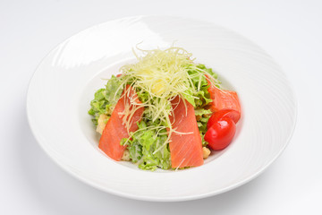 Caesar salad with smoked salmon. White background, menu concept.