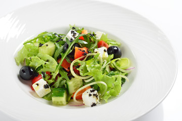 Fresh Greek salad, white background