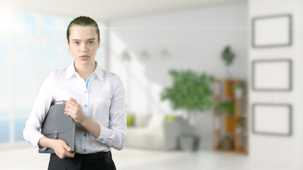 Fototapeta premium Young beautiful business woman and creative designer standing over blured interior background