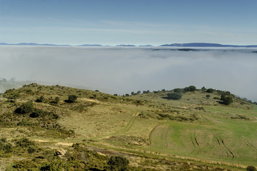 mountain scenery with fog in the mounts Obarenes in the north of the province of Burgos, Spain