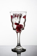 Raspberry in a  glass with splash