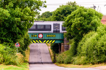 Day view of UK motorway highway under railway bridge