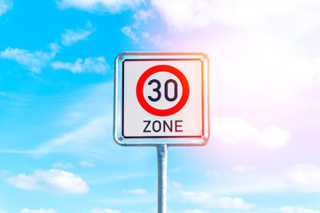 Speed limit sign to 30 in the suburbs