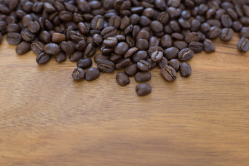Coffee Beans Scattered on Wood Table
