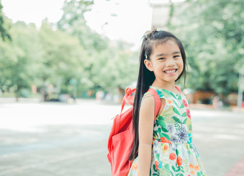 Happy Asian Girl Arriving School From Home With A Backpack