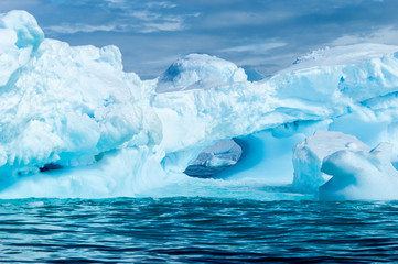 A vivid blue iceberg along the Antarctic Peninsula.