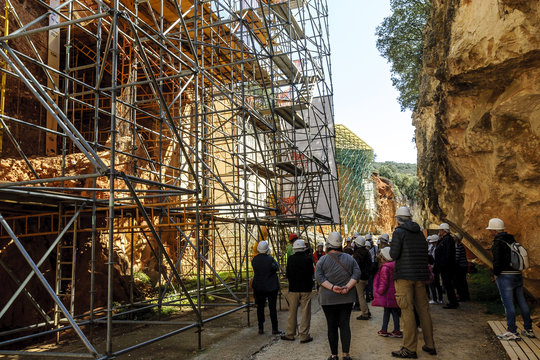 tourists visiting the excavations in the archaeological Atapuerca deposit in Burgos, Spain.
