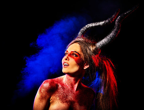 Mad satan woman on black magic ritual of hell. Witch reincarnation mythical creature Sabbath. . Zodiac Capricorn Aries. Make-up for night club for demon inflicts damage. Astral magic.