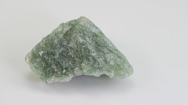 Aventurine, a green form of quartz, mineral stone isolated on a white background