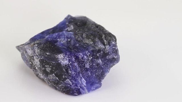 Sodalite, blue tectosilicate mineral ornamental gemstone isolated on a white background