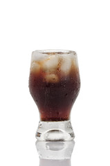 Soft drink with ice and bubbles isolated on white