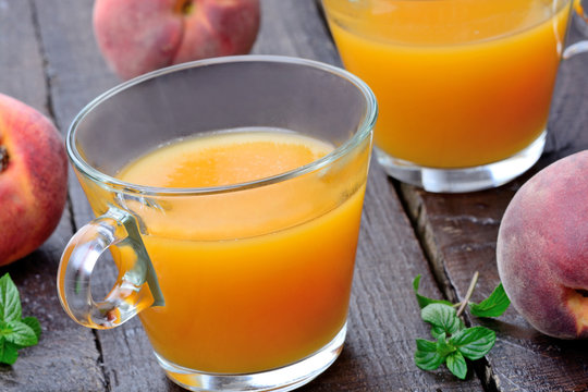 Peach juice in a glasses on table