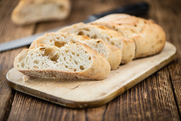 Fresh made Baguette on a rustic background