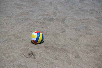 Ball for beach volleyball lies on the sand before the game