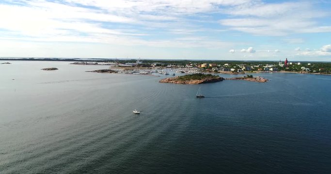 Sailboat on baltic sea, Cinema 4k aerial tilt view over a sailboats, just outside Hanko city, on hango regatta day, in the finnish archipelago in Finland