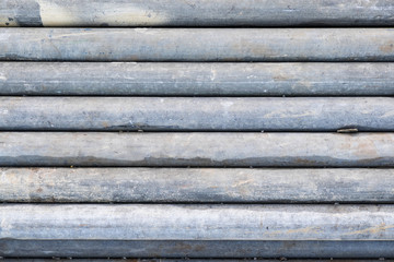 Old grey industrial scaffolding tube pipes