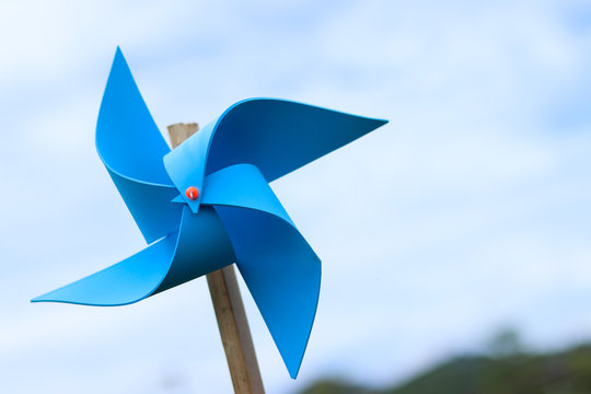 wind turbine toy with sky , save energy concept. 