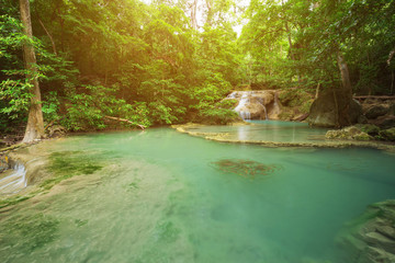 Naklejka premium Level 1 of Erawan Waterfall with Neolissochilus stracheyi fish in Kanchanaburi, Thailand