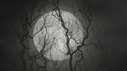 Closeup shot of a full moon silhouetting a scary / creepy tree 