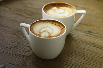 Two white cups of coffee