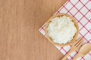 grains cooking of Thai jasmine rice or white rice in wooden bowl on wooden Background
