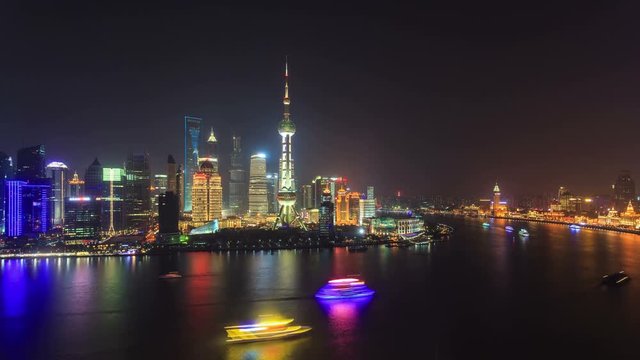 Shanghai skyline at night. On the left, Pudong with the Oriental Pearl Tower. On the right, The Bund (Puxi Waitan). 