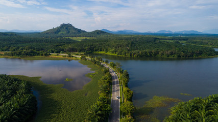 Aerial view of reservoir dam during sunny day.