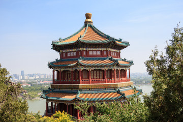 View on Pagoda tower in the Summer Palace imperial park in Beijing, China with the city in the background