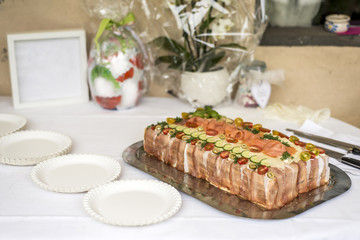 special traditional Sandwich cake layers with ham, vegetables cheese and sauces