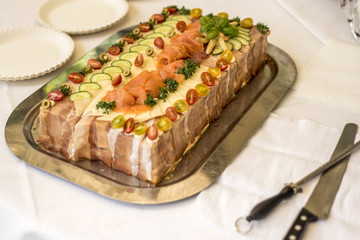 special traditional Sandwich cake layers with ham, vegetables cheese and sauces