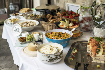 Variety of fresh salads bowls on buffet table business dinner
