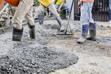 Men Cementing Road