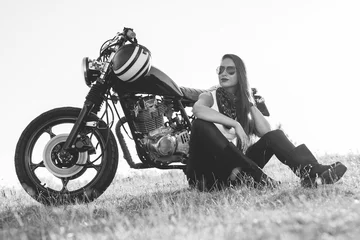Printed kitchen splashbacks Motorcycle   Black-and-white portrait of a beautiful biker woman sitting by her motorcycle