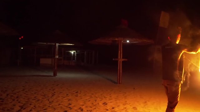 Two firedancers on beach in Philippines