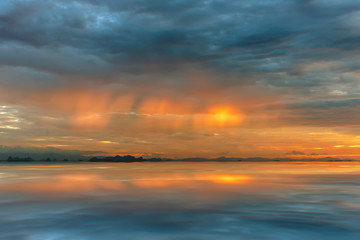 Cloudscape scene and rainfall with sunlight.