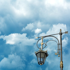 Fototapeta na wymiar Silhouette of a street lamp on the background of the beautiful sky