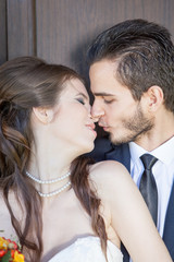 Happy just married couple kissing. wedding photo