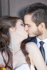 Happy just married couple kissing. wedding photo