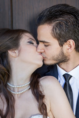 Happy just married couple kissing. wedding photo
