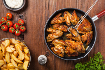 Baked wings, served with dip or baked potatoes.