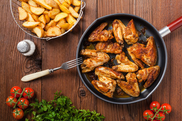 Baked wings, served with dip or baked potatoes.