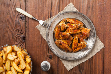 Baked wings, served with dip or baked potatoes.