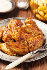 Baked wings, served with dip or baked potatoes.